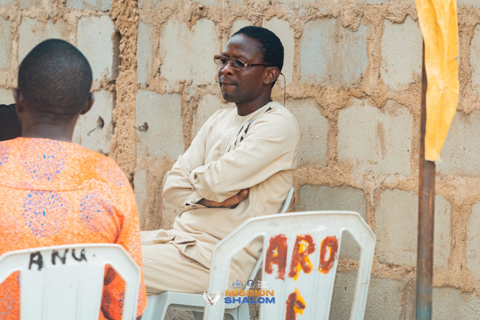 A follow-up volunteer in a one-on-one conversation with a new convert