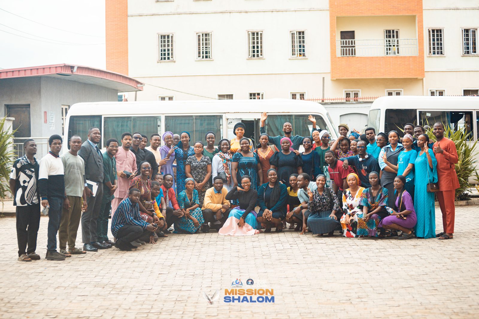 Mobile Harvesters team gathered by the mission bus before deployment